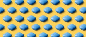 Blue viagra pills on a yellow background