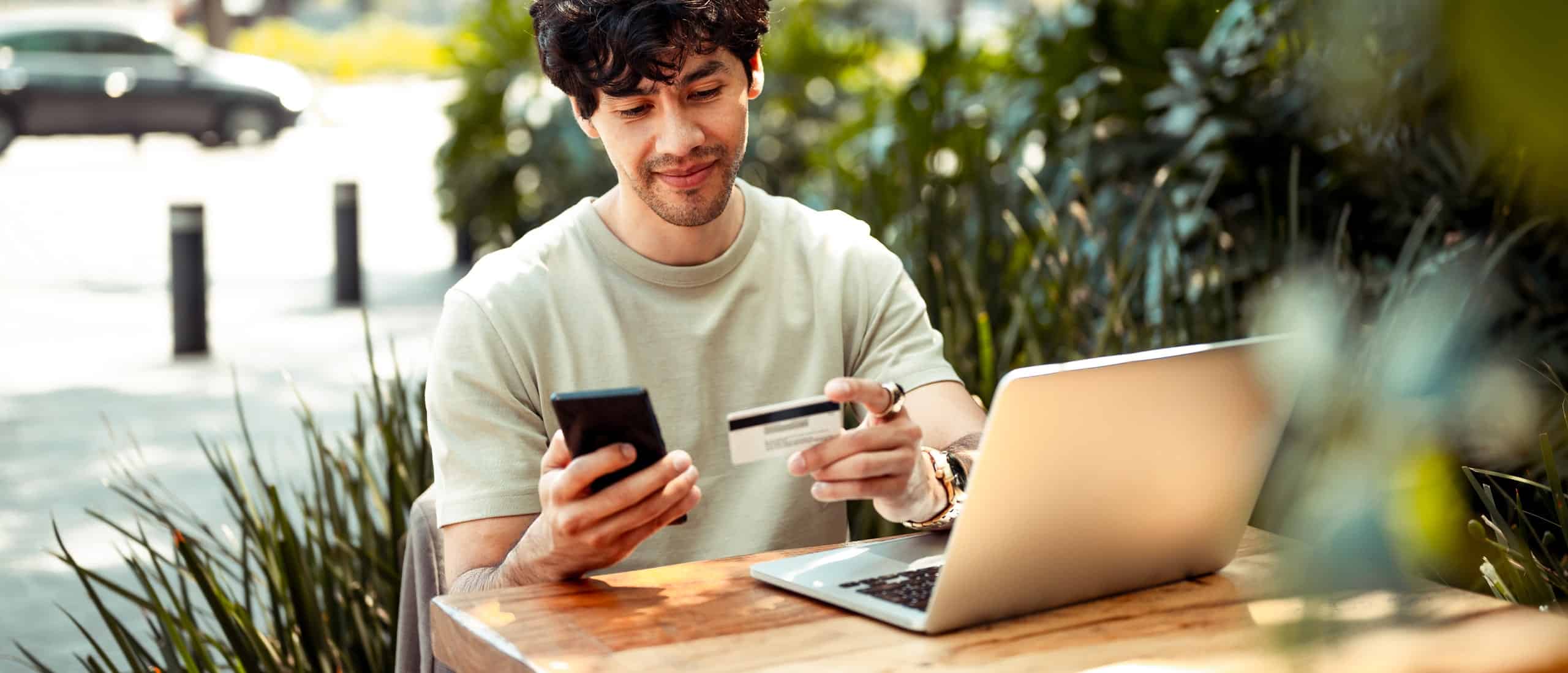 A man using his credit card to buy testosterone online legally