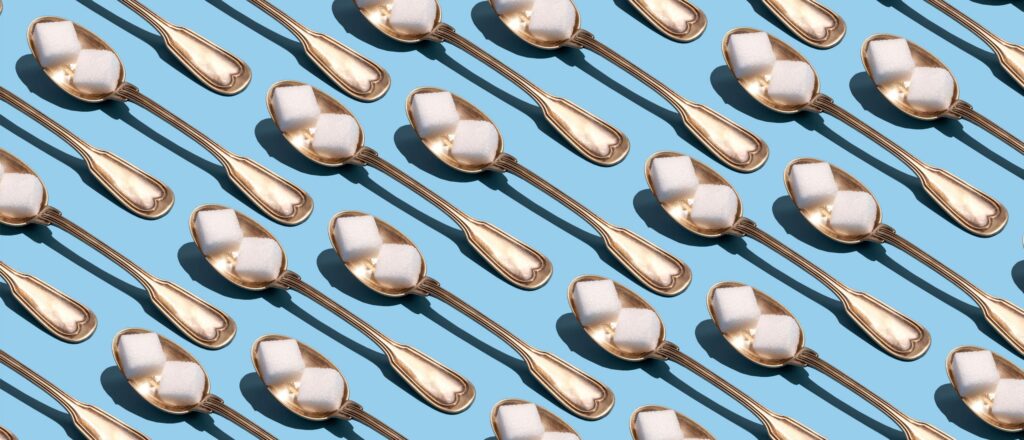 a grid of sugar cubes on spoons