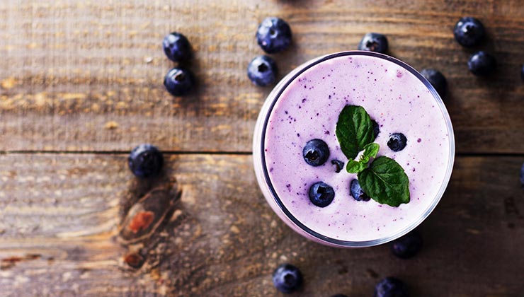 a blueberry smoothie and blueberries