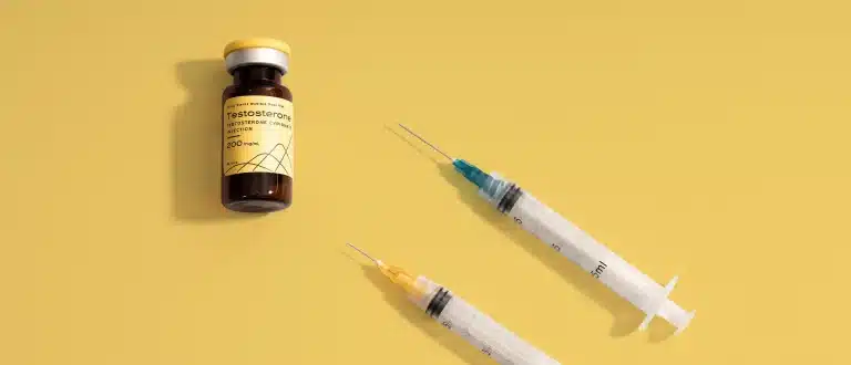 Hone Health testosterone vial and 2 syringes on yellow background