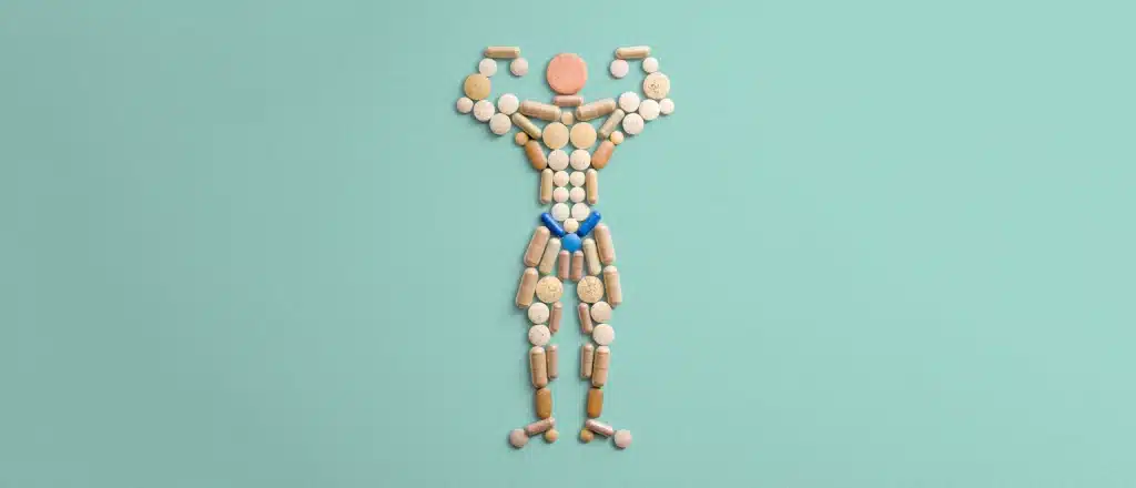 Pills and supplements in the shape of a man