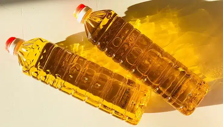 overhead shot of vegetable oil in plastic bottles on counter