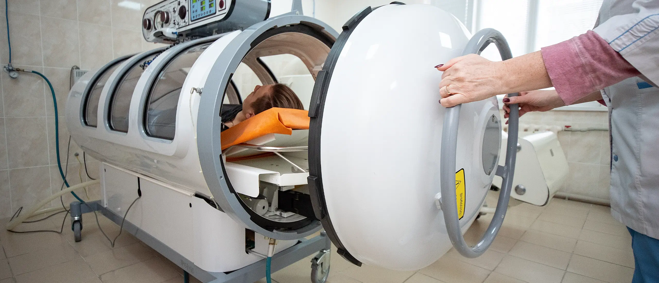 someone being put into a hyperbaric chamber