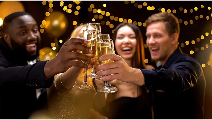 people toasting with champagne glasses at an event