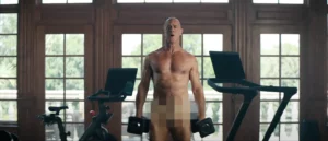 Chris Meloni naked in a peloton ad curling dumbbells