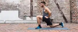a man does a lunge outside