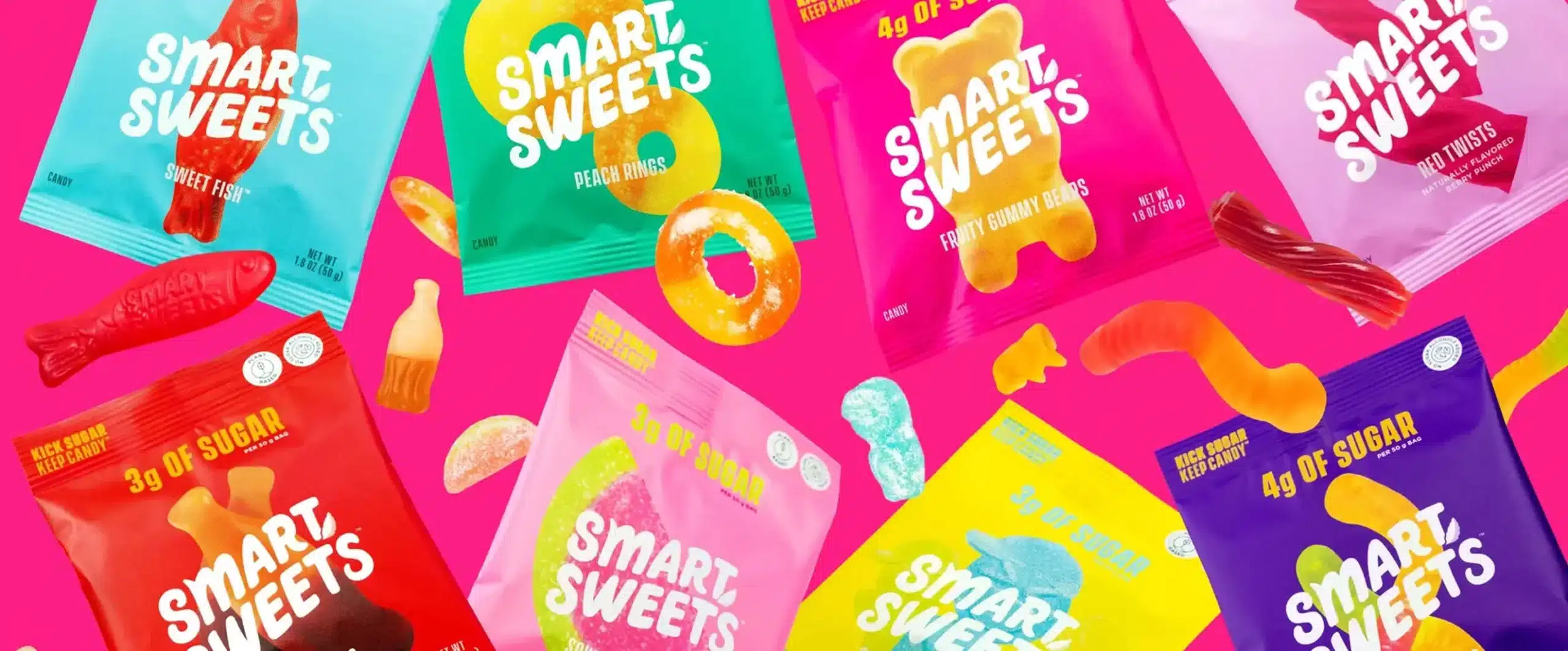 SmartSweets candies on pink background