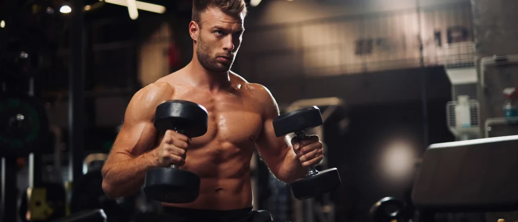 man holding dumbbells at chest height