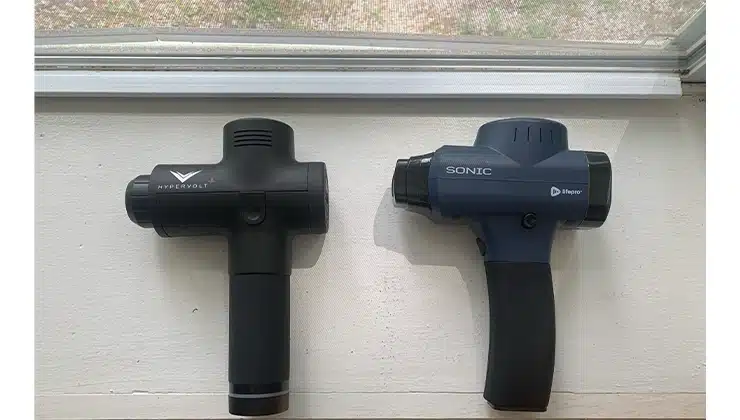 2 massage guns side by side on table