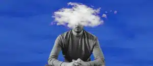 a man with clouds over his head to represent brain fog