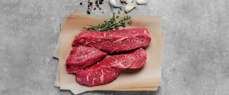Raw steak on butcher paper