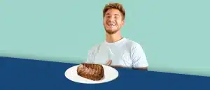 Man sitting at table with a large steak in front of him