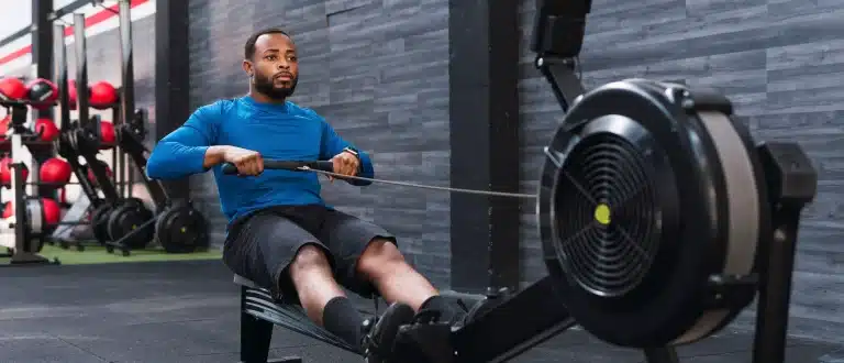 man rowing on a rowing machine