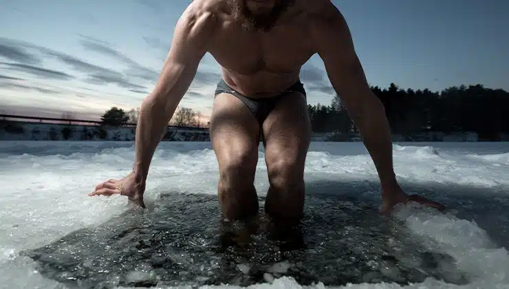 man getting in cold plunge