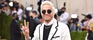 Pete Davidson flashes a peace sign