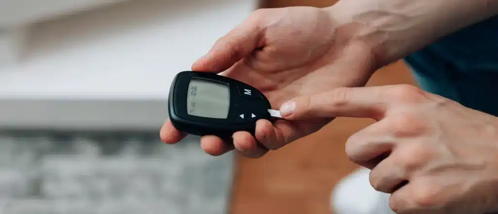 checking blood sugar with a monitor