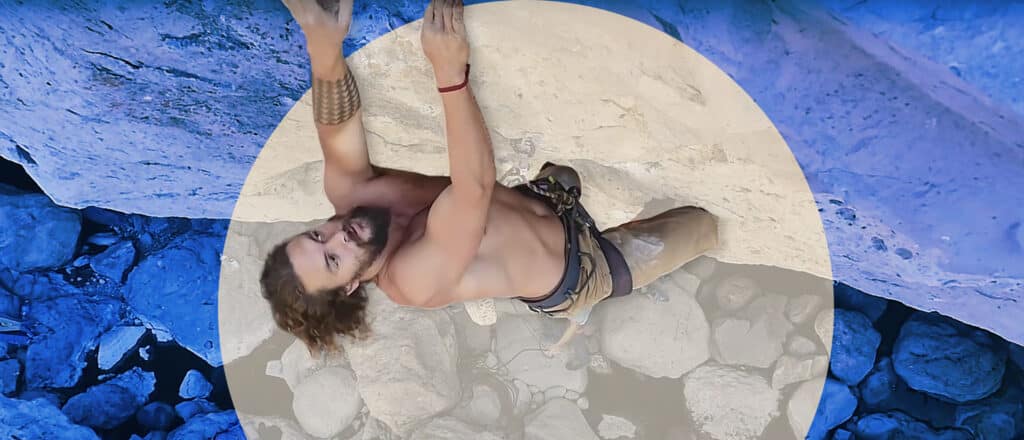 Jason Momoa climbs a rock face