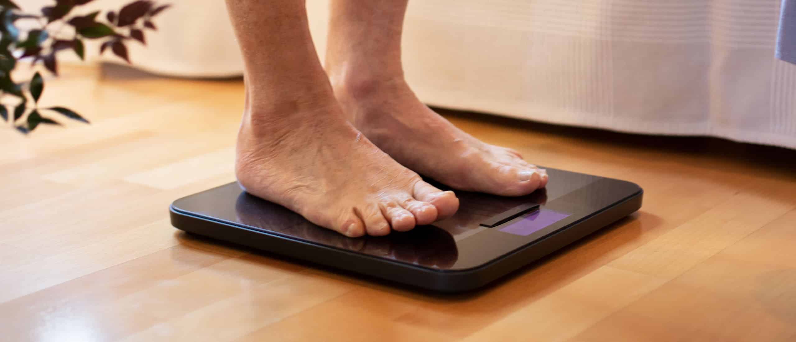 Man standing on weight scale