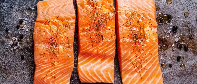 Salmon filets on a metal background