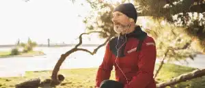 Man stretching in park before going for run