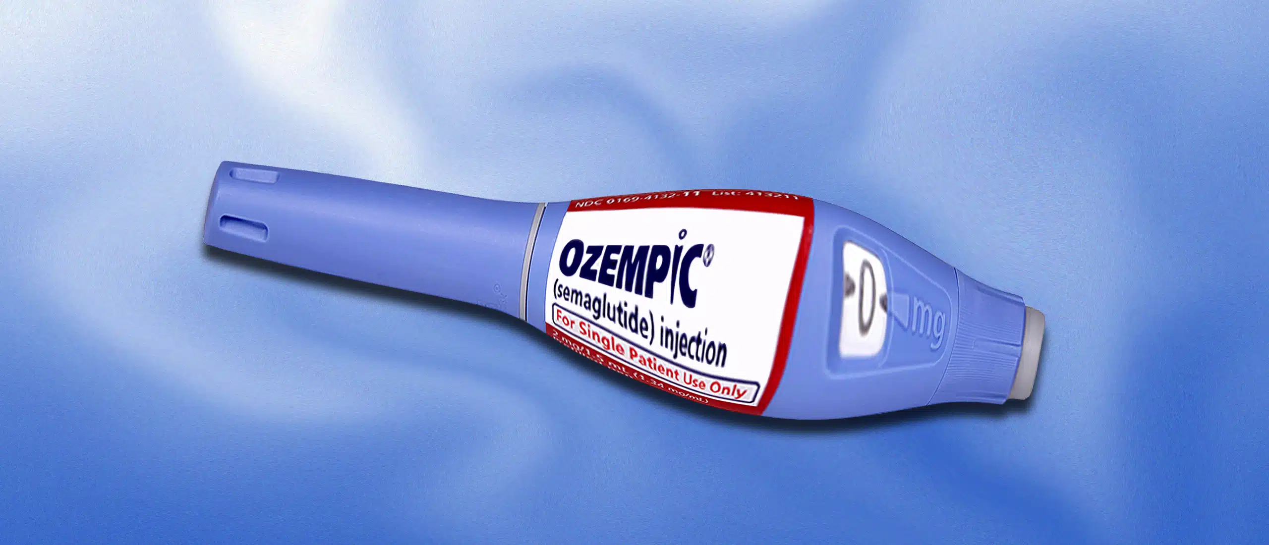 An engorged ozempic injector pen on a blue background