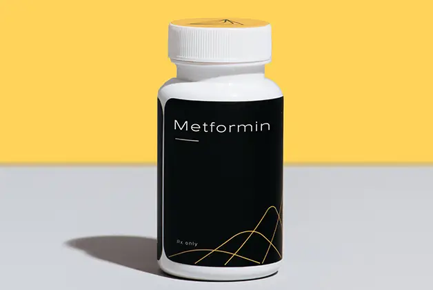 Hone Health Metformin bottle on grey and yellow background