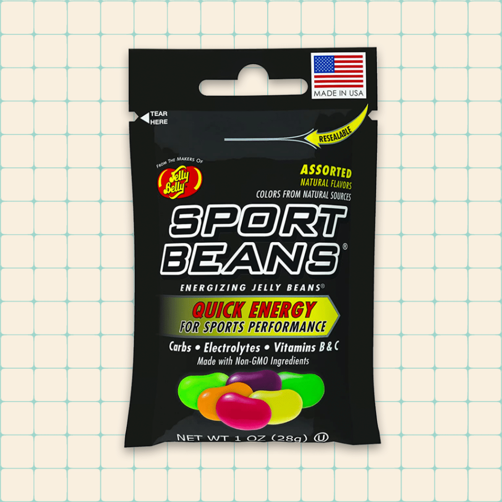 Jelly Belly Sport Beans on beige grid background