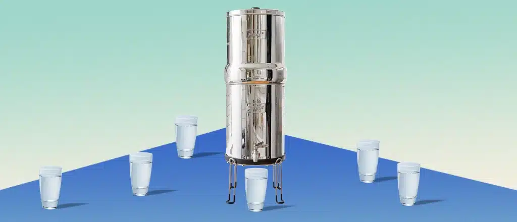 Big Berkey water filter surrounded by clear, refreshing cups of water