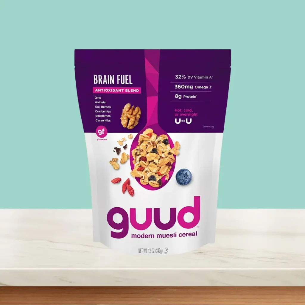 Guud Modern Muesli Cereal on table and green background