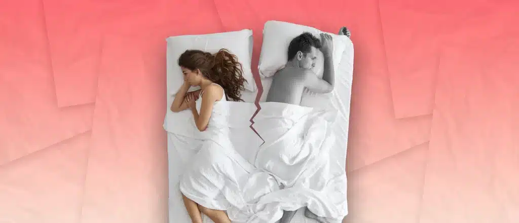 Man and woman in bed with crack down the middle