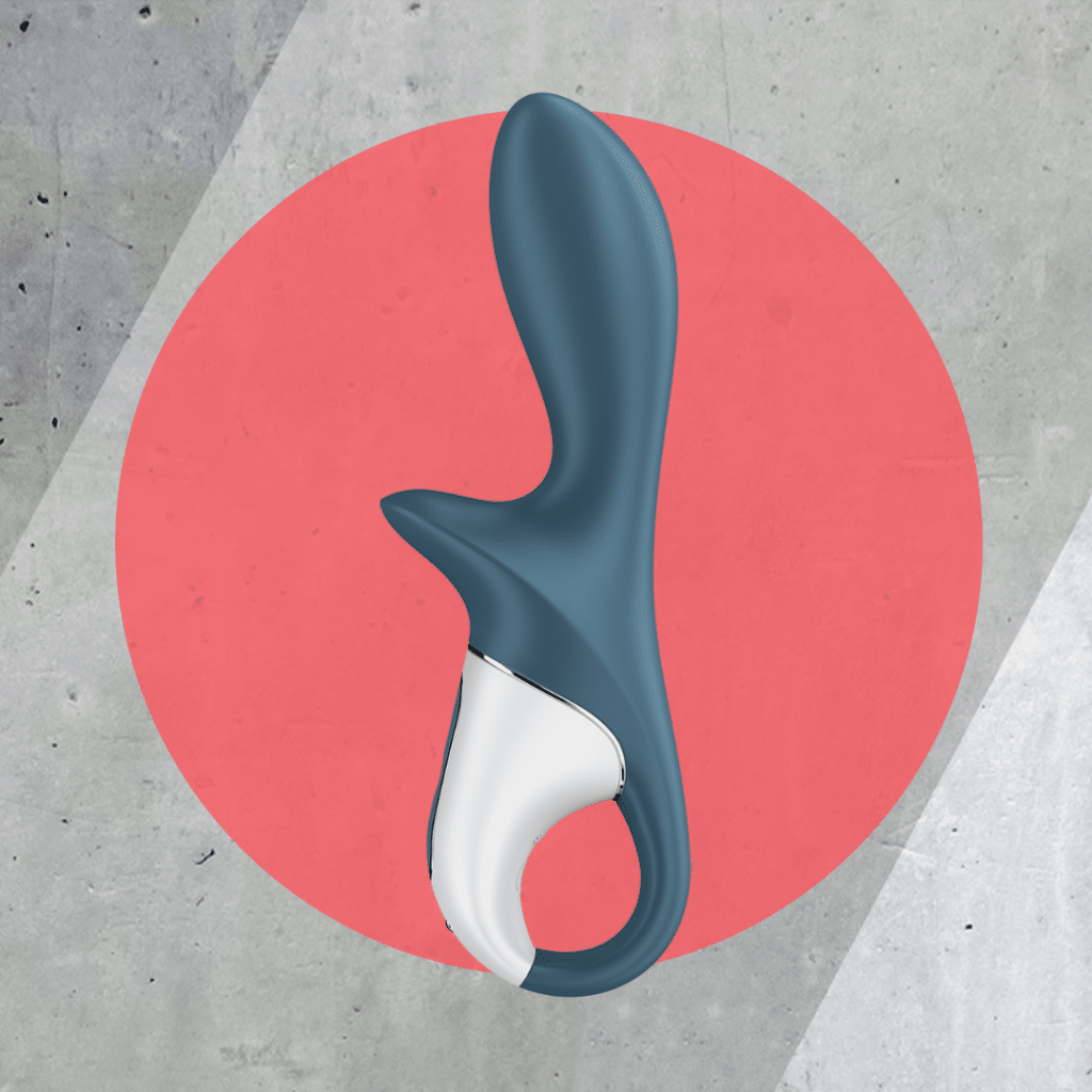 Satisfyer Air Pump Booty 2 on red and cement background