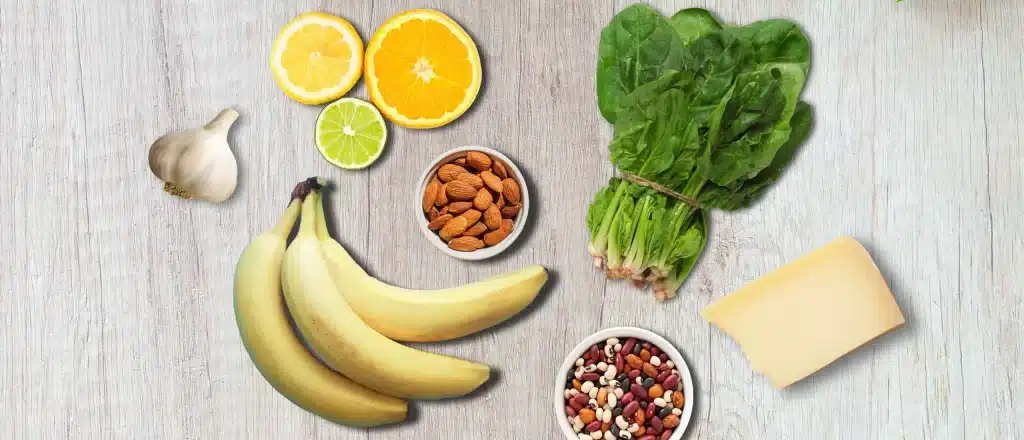 butyrate foods like leafy greens, bananas, citrus, almonds, and cheese looking tasty