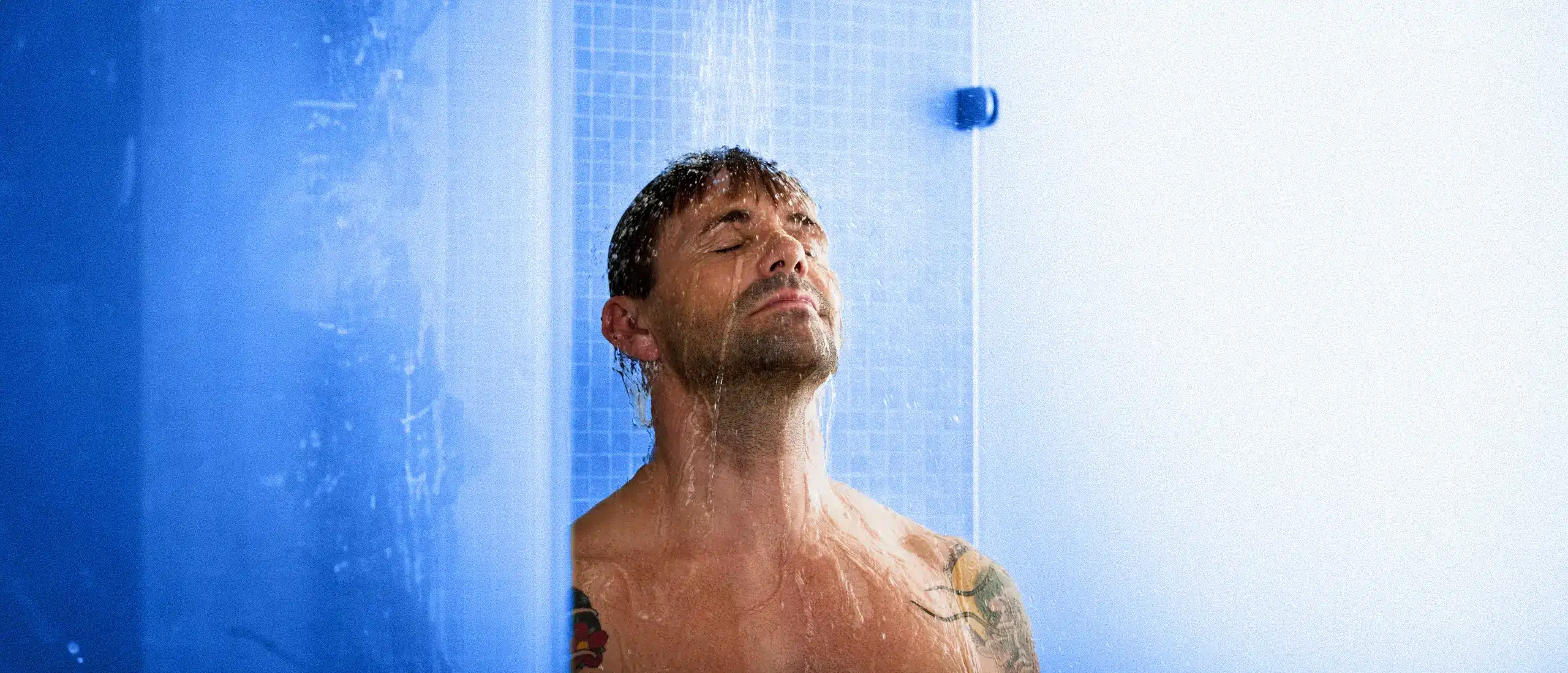 Man looking way to relaxed in a cold shower