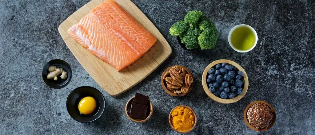 Cortisol lowering foods like omega-3 fatty acid-rich salmon, berries, citrus, nuts, and seeds