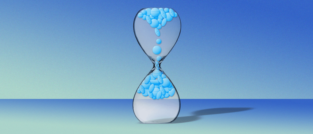 Pills falling upwards in an hourglass