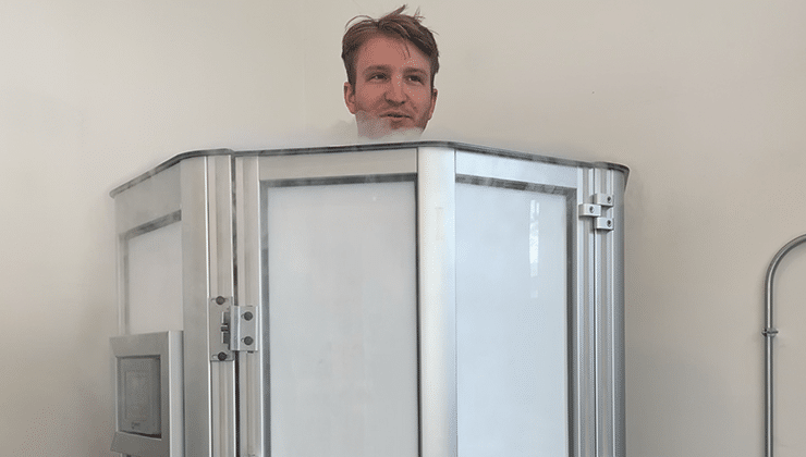 Man standing in cryotherapy chamber