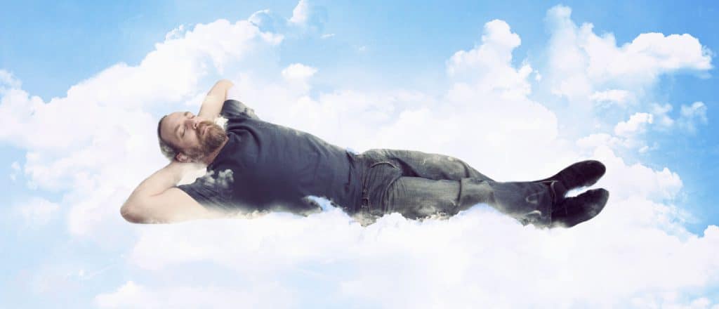 man sleeping on a cloud