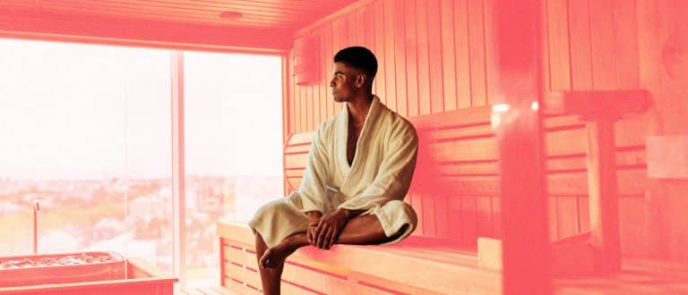 man sitting in sauna