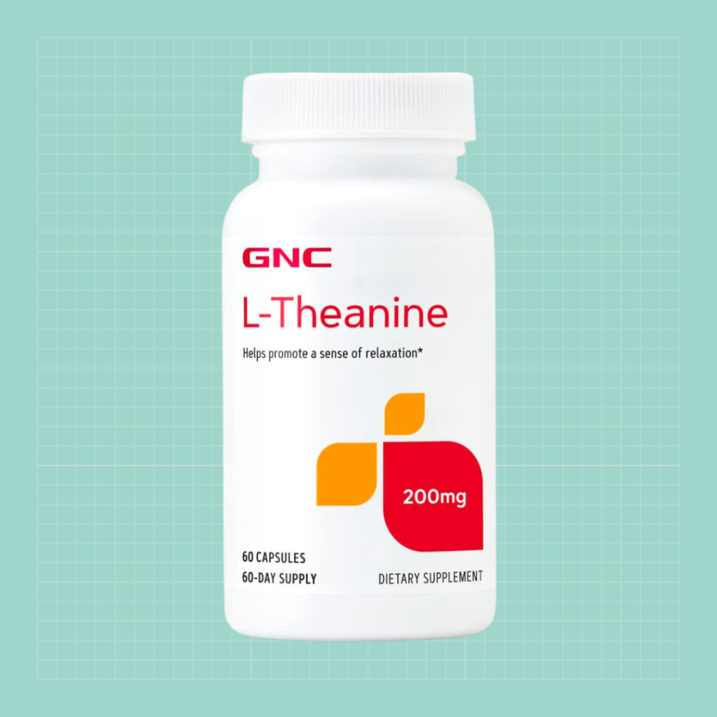 GNC L-Theanine supplement on green background