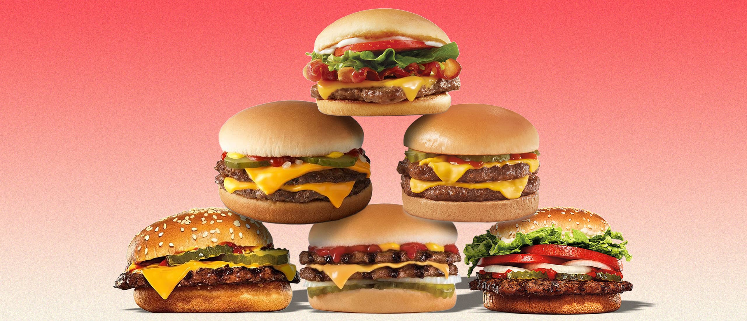 Cheeseburgers stacked sky high.