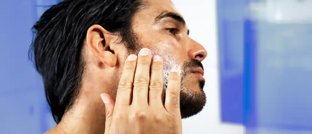 man using minoxidil for beard growth