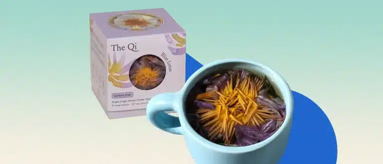 the qi blue lotus tea on light blue background