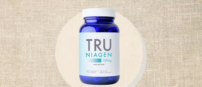 bottle of tru niagen supplement on textured background