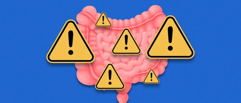 A gut with warning signs surrounding it | Signs of poor gut health