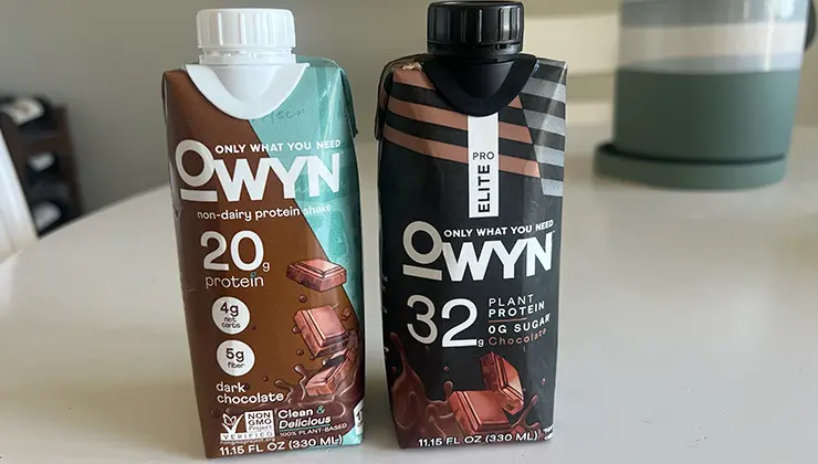 OWYN Protein Shake and Pro ELite Shake next to each other on a counter.