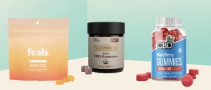 CBD gummies on counter with green background
